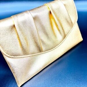Gold Metallic vintage clutch in like new condition